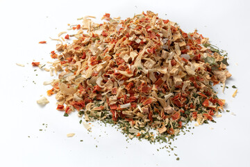 Dried vegetables seasoning. Dry cut and chopped up vegetables mix. Natural spices on white background