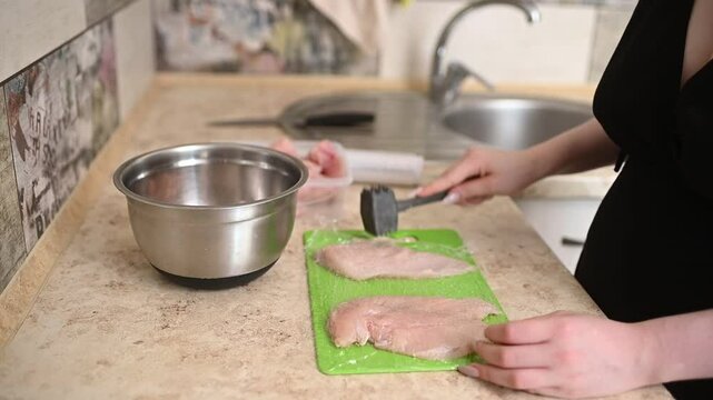 Cooking Breast Chicken Meat, Beat Chicken using Meat Tenderizer. Cooking Process in The Kitchen.