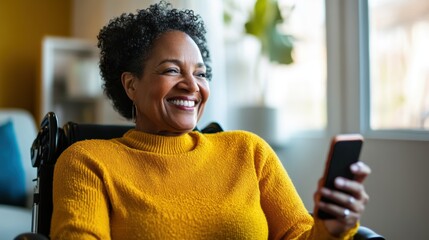 Woman in a yellow sweater smiling while using smartphone in a bright room