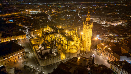 Naklejka premium Aerial Night View of Illuminated Historic Cathedral