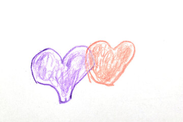 Drawing on a sheet of paper with colored pencils, heart symbols.