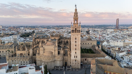 Fototapeta premium Aerial View of Seville Cathedral and Giralda at Sunset