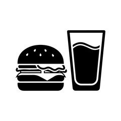 A black  white image of a burger with seeds on top and a full glass of a drink