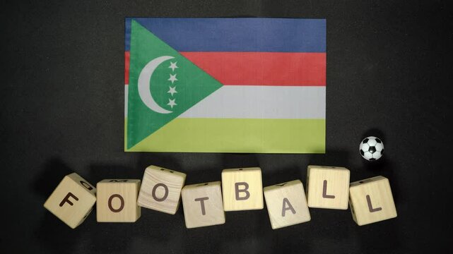 Comoros flag with football title. football concept