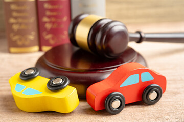 Hammer gavel judge with car vehicle accident, insurance coverage claim lawsuit court case.