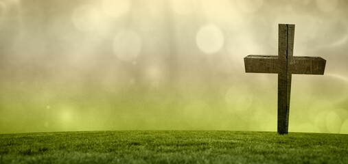 Lone wooden cross is standing on grassy hill in flat design, showing sunlight rays with bokeh