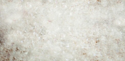 Granular white crystals are filling frame in flat design style, showing translucent off-white tones