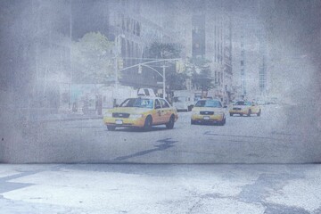 Textured mural is showing urban street scene in gallery space, with yellow taxis and traffic lights