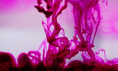 Pink ink spreading in the water