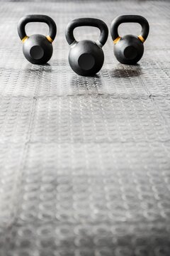 Fototapeta Kettlebells on floor in gym