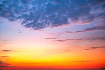 Sky,Beautiful sunset view, luxury soft gradient orange gold clouds and sunlight on the blue dramatic sky perfect for the background, morning, evening,Twilight, climate change,horizontal sunset photo
