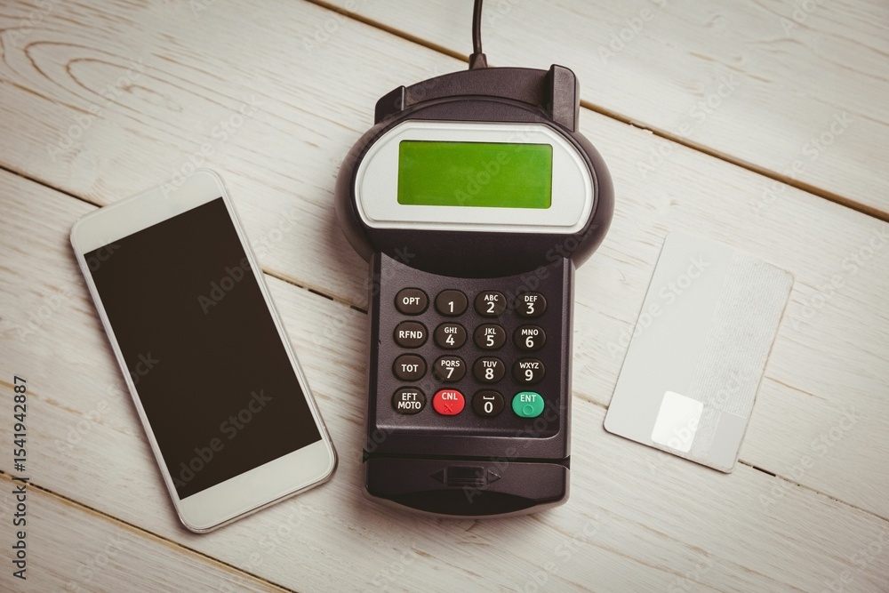 Poster showing flat design overhead view of phone, payment terminal and credit card on whitewashed table