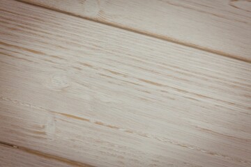 Obraz premium Light wood plank surface is being shown in flat design, with visible grain and knots