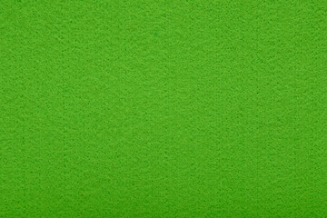 Light green felt texture background - close-up of soft fabric surface. Seamless background, graphic design, scrapbooking, textile layouts, creative projects.