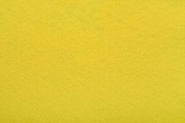 Yellow felt texture background - close-up of soft fabric surface. Seamless background, graphic design, scrapbooking, textile layouts, creative projects.