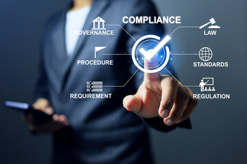 Compliance concept with businessman tick checkmark to comply the regulation requirement or standard and law