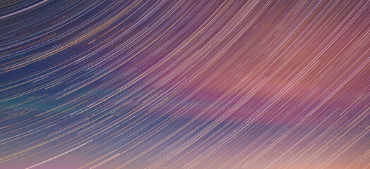 Panoramic View Of Night Sky. Unusual Stars Effect Sky. Meteors Fly Across Night Sky. Large Exposure. Blurred Stars In Sky. Soft Colors. Light Magenta Sky Background. Amazing Stars Effects In Sky. Blue