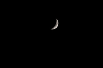Moon in the waxing crescent phase (view from the northern hemisphere) in dark sky