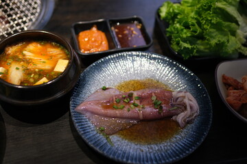 Seafood vegetables sauce. blue plate with seafood. High quality photo