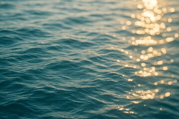 Shimmering Golden Ripples on Tranquil Ocean Surface