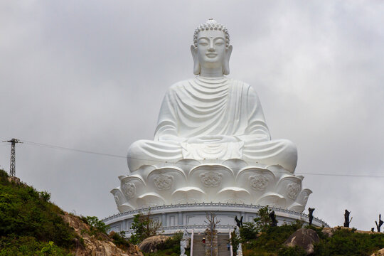 Binh Dinh, Vietnam - &lrm;&lrm;March 11, 2021 : A Colossal White Seated Buddha Statue at Linh Phong Pagoda (Ong Nui Temple) on a Mountain in Binh Dinh Province.