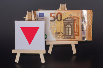 50 Euro Banknote and Red Arrow Sign on Miniature Easels – Financial Concept