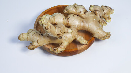 Ginger Root: A close-up view of fresh, aromatic ginger roots, harvested and ready for culinary use,...