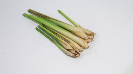 Fresh Lemongrass: A bunch of vibrant lemongrass stalks lies, evoking a sense of natural freshness and culinary appeal.
