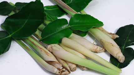 Fresh Lemongrass and Leaf: Fresh, fragrant lemongrass stalks and vibrant, green leaves create an appealing visual, perfect for culinary themes or themes of natural freshness.