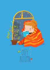 Girl drinking a cup of tea or coffee by window with rain