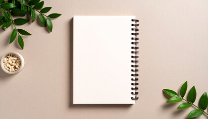 Top-down view of a simple journal with empty front cover on textured paper backdrop