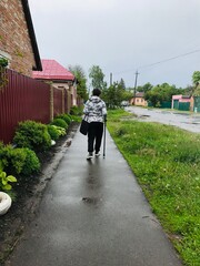 Active elderly person with disability enjoying a walk outdoors