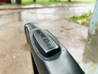 Travel suitcase handle showing push button mechanism