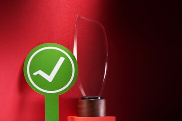 green circle with check mark and crystal trophy
