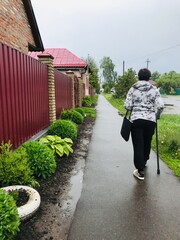 Active elderly person with a disability enjoying a walk outdoors