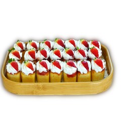 Slices of cakes with fresh strawberry and chocolate sticks on white background. Sweet snack desserts.