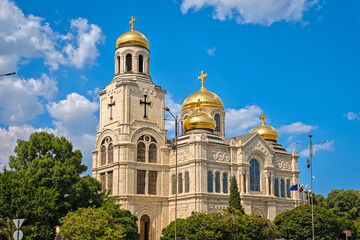 Golden Domes of Orthodox Cathedral Shining Under Blue Sky. Stunning Religious Architecture and Travel Landmark. Varna, Bulgaria