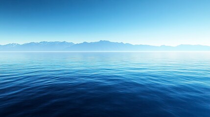 Obraz premium Calm lake with distant mountains