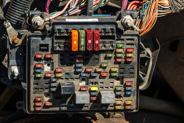A fuse block in a wrecked truck