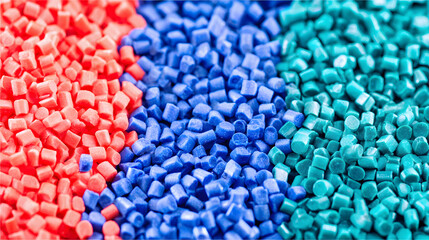 Vibrant Red, Blue, and Teal Plastic Granules in a Detailed Close-up, Showcasing Raw Materials for Recycling and Manufacturing Industries