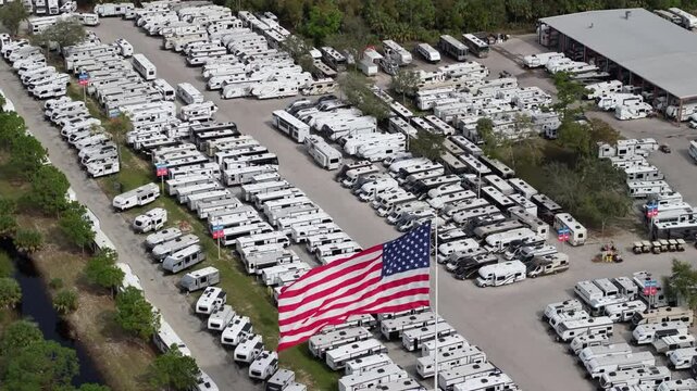 RV dealer parking lot with camping travel trailers for sale in Florida.