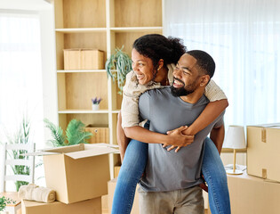 Portrait of a young couple unpacking, moving in and relocation to a new apartment, happy young couple family new beginning