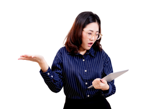 Asian young beautiful woman with glasses and a striped shirt looks surprised while holding and reading a tablet.