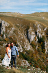 Romantic couple embracing outdoors in nature