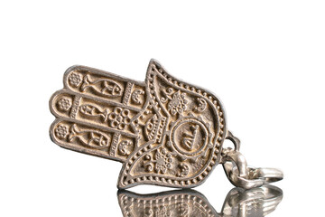 Hamsa hand amulet isolated on white, close-up.	
