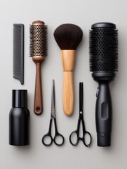 Collection of hair styling tools and accessories on gray background.