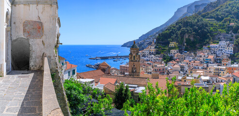 Townscape of Amalfi from tipycal pathway in Italy: in the center glimpse of bell tower of cathedral.