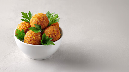 Savory Delights: Golden fried balls nestled in a pristine white bowl, adorned with vibrant green parsley, this shot tantalizes with flavors and textures.