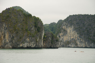 People kayaking in Lan Ha Bay. Cat Ba Archipelago. Vietnam.