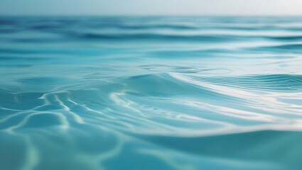tropical ocean gradient from deep blue to aquamarine, with soft ripples and reflections